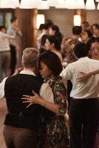 social tango dancers dancing in a milonga